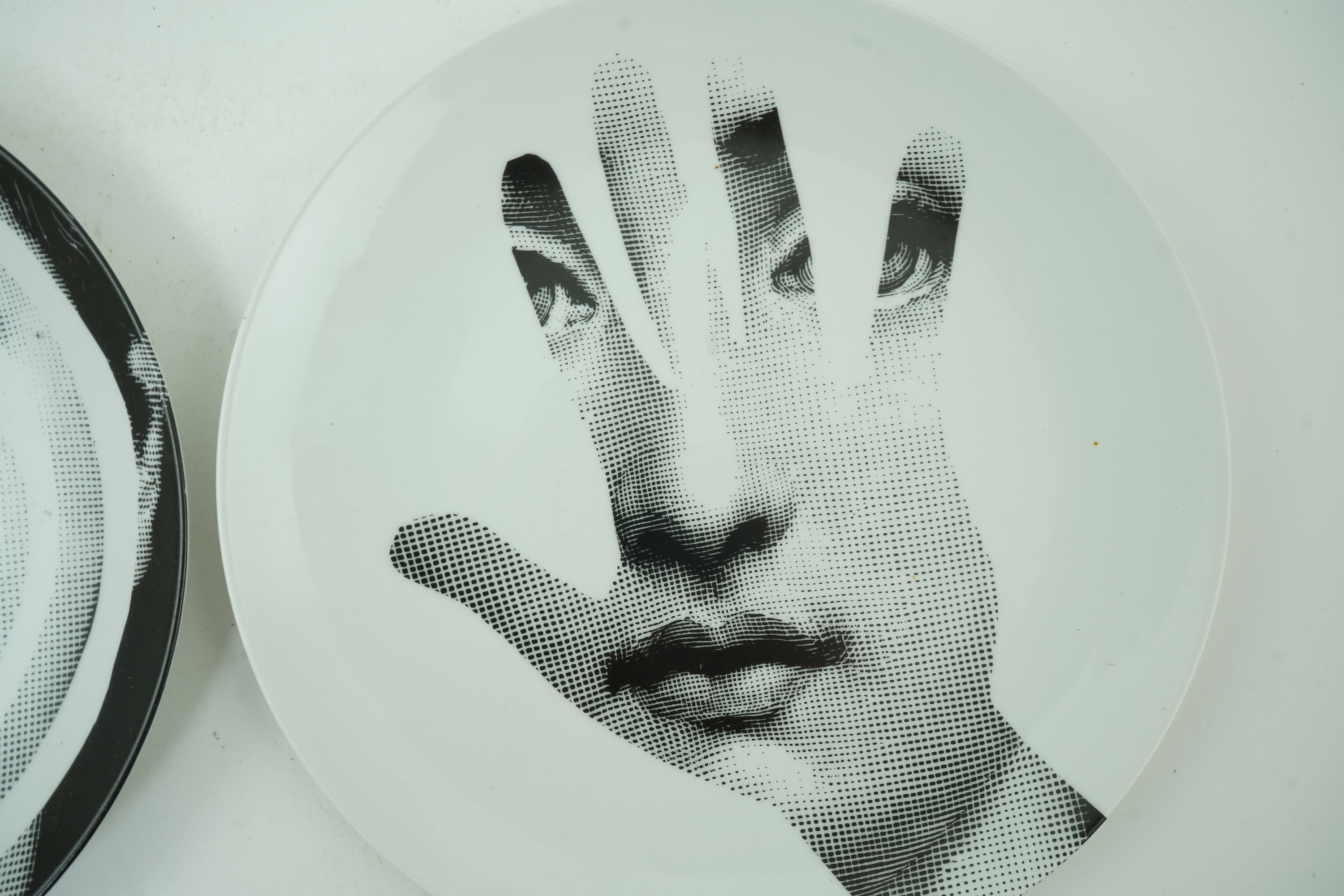 Piero Fornasetti (Italian, 1913-1988): Two 'Tema a Variazioni' plates
